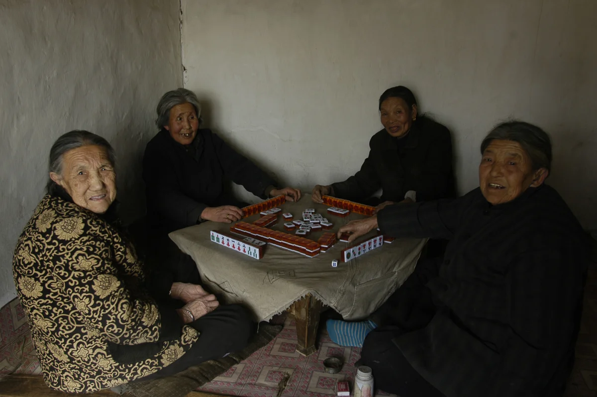 Meng Shujing (82)(L) with her two friends Yao Yun (82) (C) and Zhao Feng Lan (82) (R) also Manchu speakers in Sanjiazi near the town of Qiqihar in Heilongjiang province in North-east China. 2007