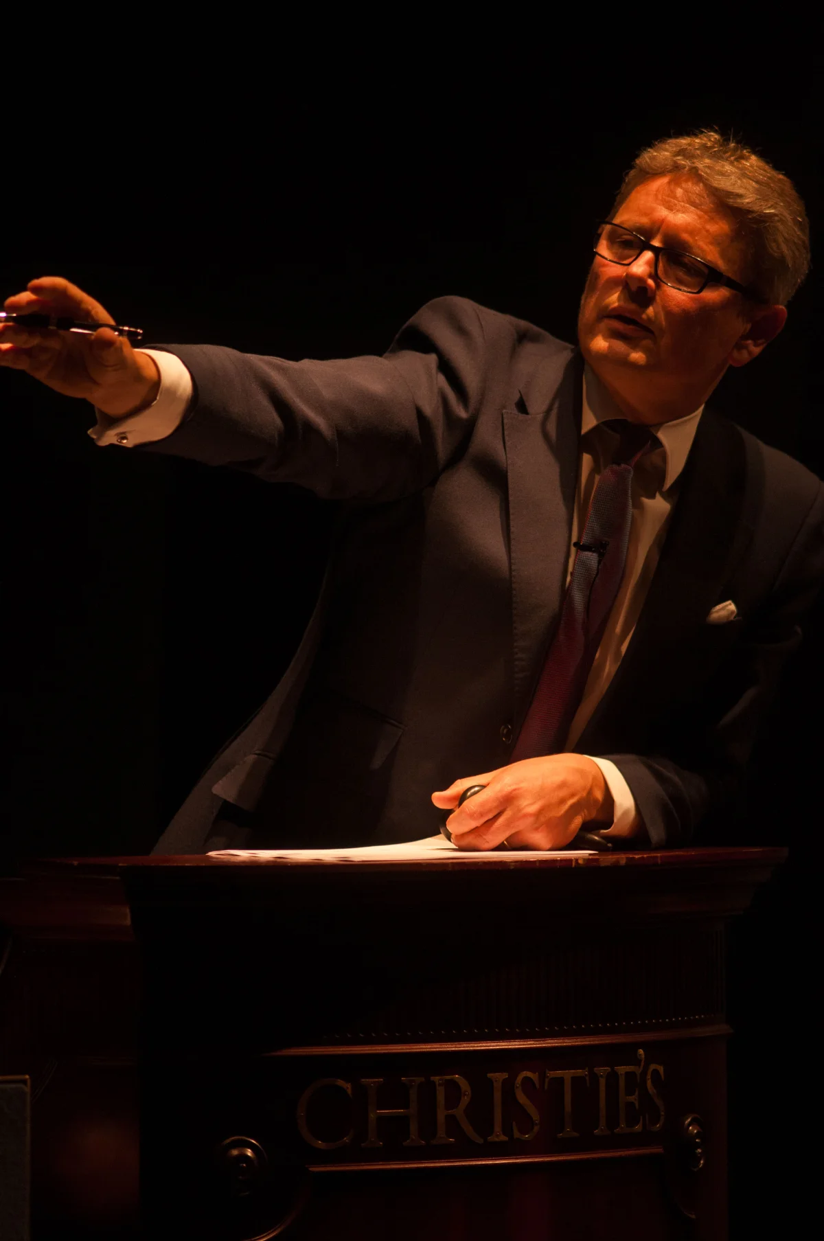 Jussi Pylkkänen, the global president of the auction house Christie's, directs a sale. 2014