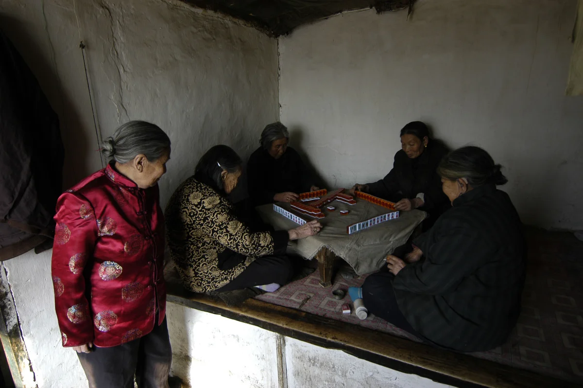 Meng Shujing (82)(L) with her two friends Yao Yun (82) (C) and Zhao Feng Lan (82) (R) also Manchu speakers in Sanjiazi near the town of Qiqihar in Heilongjiang province in North-east China. 2007